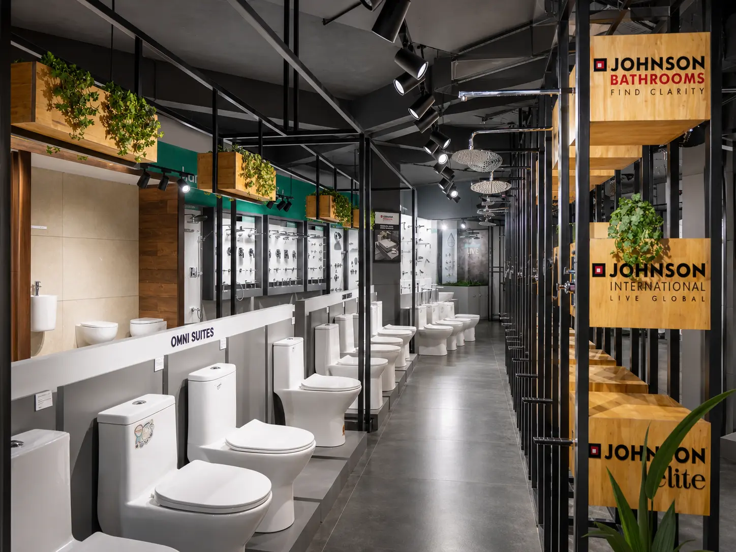 Long sanitaryware aisle with WC displays and Johnson bathroom branding.