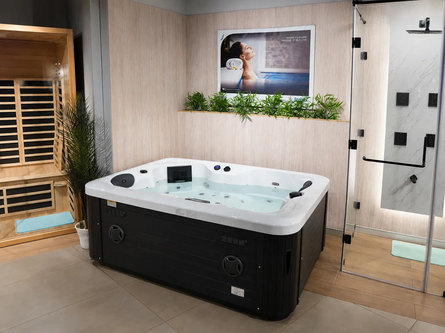Spa display zone with hot tub, sauna cabinet, shower area and indoor greenery.