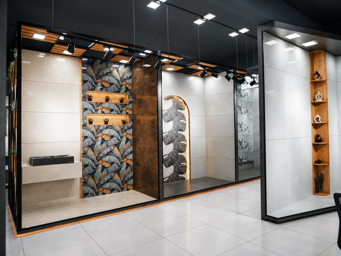Clean modern tile display bays with decorative panels, shelves and accent lighting.